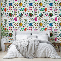 Mural wallpaper featuring bugs and blooms on white

