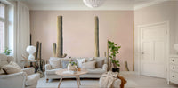 Desert-inspired mural with soft pink cactus silhouettes

