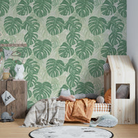 Monstera leaf wall mural creating a tropical atmosphere.


