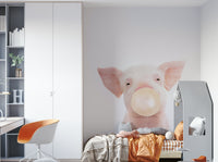 Whimsical piglet mural with bubble gum bubble in pink tones

