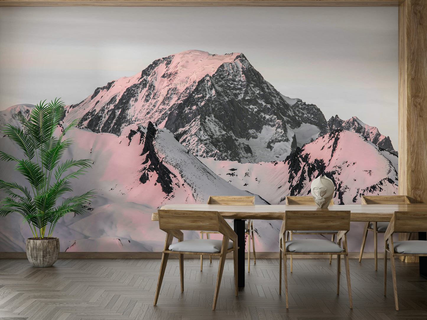 Serene snowcapped mountain mural with pinkish tones and sharp peaks.

