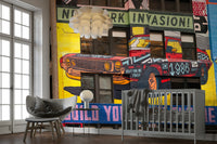 Graphic city mural with bold messages and car art

