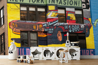 Pop art car mural with NYC invasion headline

