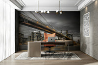 Dramatic bridge mural featuring lit-up New York skyline

