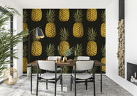 Luxurious golden pineapples on a bold wallpaper backdrop

