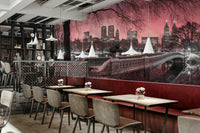 A calming view of Central Park at twilight with a pink sky captured in a mural.

