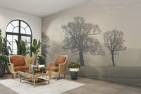 Enchanted tree landscape wallpaper with morning mist

