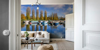 Autumn trees and moored boats in a tranquil marina mural

