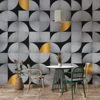 Bold geometric mural with concrete and gold accents

