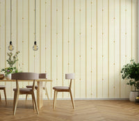 Warm buttercream and mustard wallpaper creating a cozy feel


