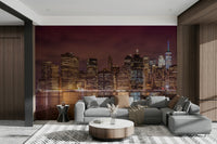 Glowing New York City skyline at night on wall mural

