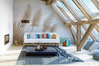 Poetry by the Sea Wall Mural with pampas grass in evening light

