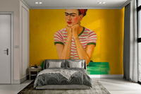 Abstract portrait mural bathed in warm golden light


