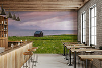 Soft, dreamy scene of a meadow and sea blending together

