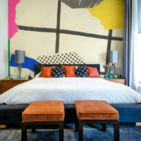 Bold summer collage mural bringing a warm, carefree spirit to the room

