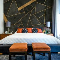 Dark charcoal mosaic wall mural with gold accents

