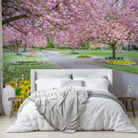 Park path mural with soft pink blossoms

