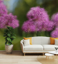 The background is a soft blend of greens and purples.

