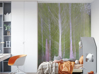 The trees and background are intentionally blurred, creating a dreamy effect.

