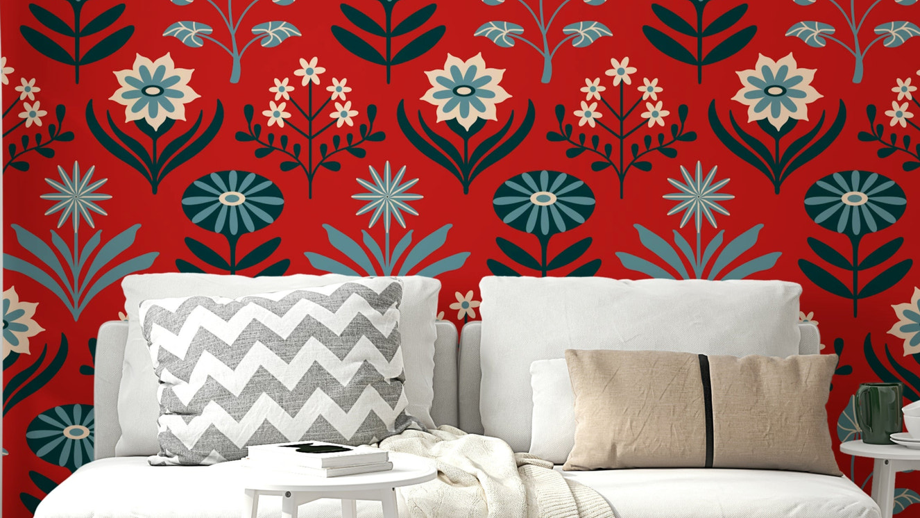 Stylized floral and leaf patterns in blue, navy, indigo, white, and dark red on a wall.

