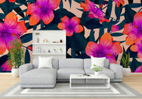 Lush green tropical leaves in a wall mural.

