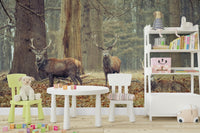 a painting of three deer in a forest

