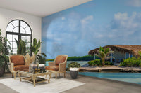 Mural with a single palm tree on the sand.

