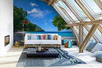 Panoramic view of a tropical beach with palm trees.

