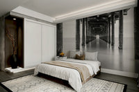 The style is photographic, with a strong focus on composition, light, and shadow in grayscale.
