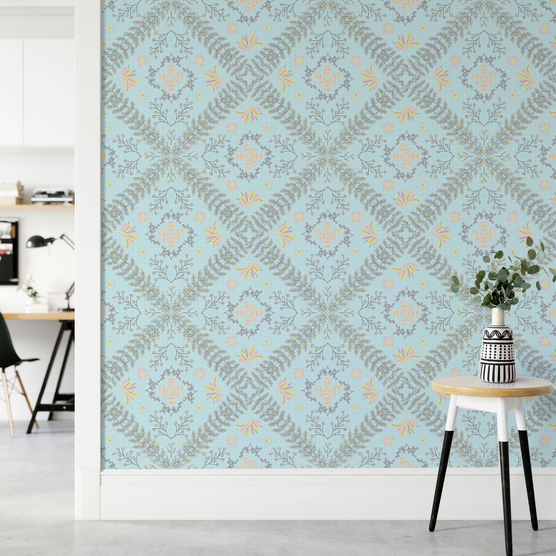 blue wallpaper with a floral pattern

