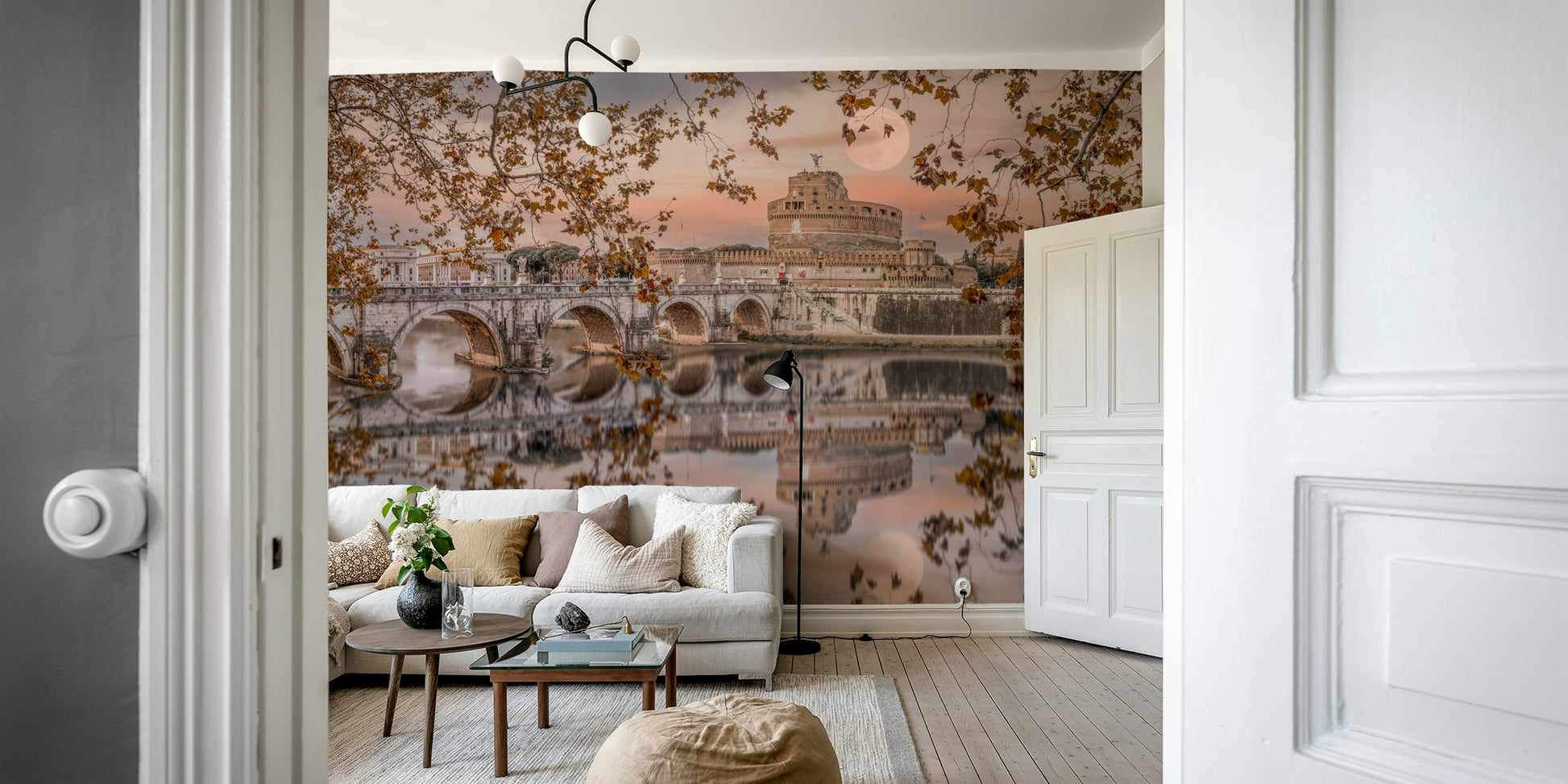 Tree branches with autumn leaves frame the scene.

