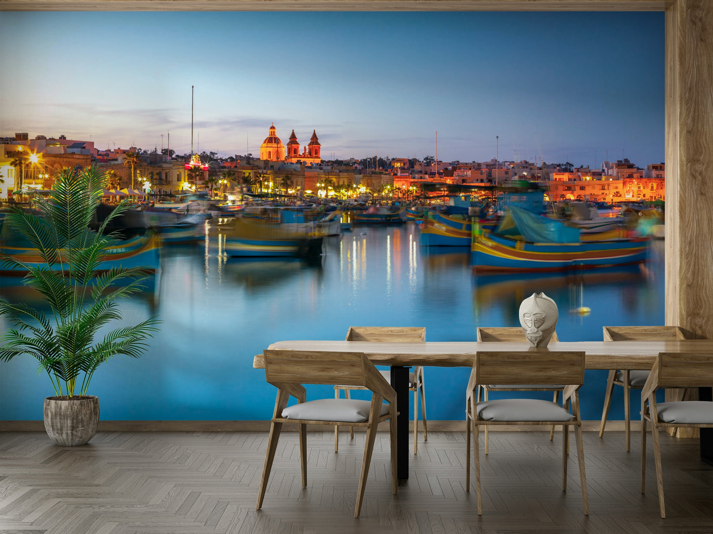 A wall mural of the Marsaxlokk harbor at dusk.

