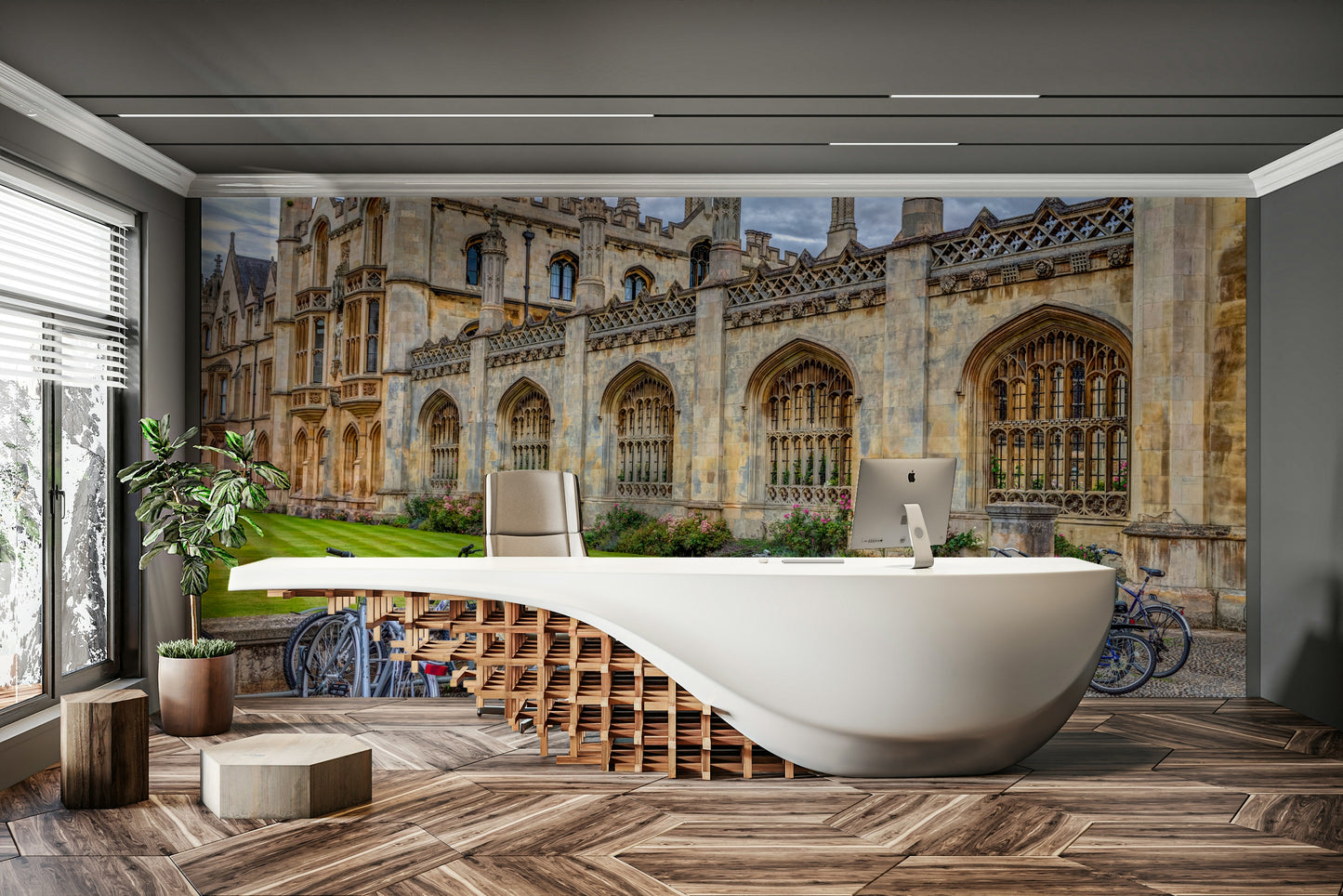 The image shows bicycles leaning against a historic university building or stone wall.


