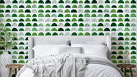 A modern wall mural with a repeating pattern of geometric shapes.

