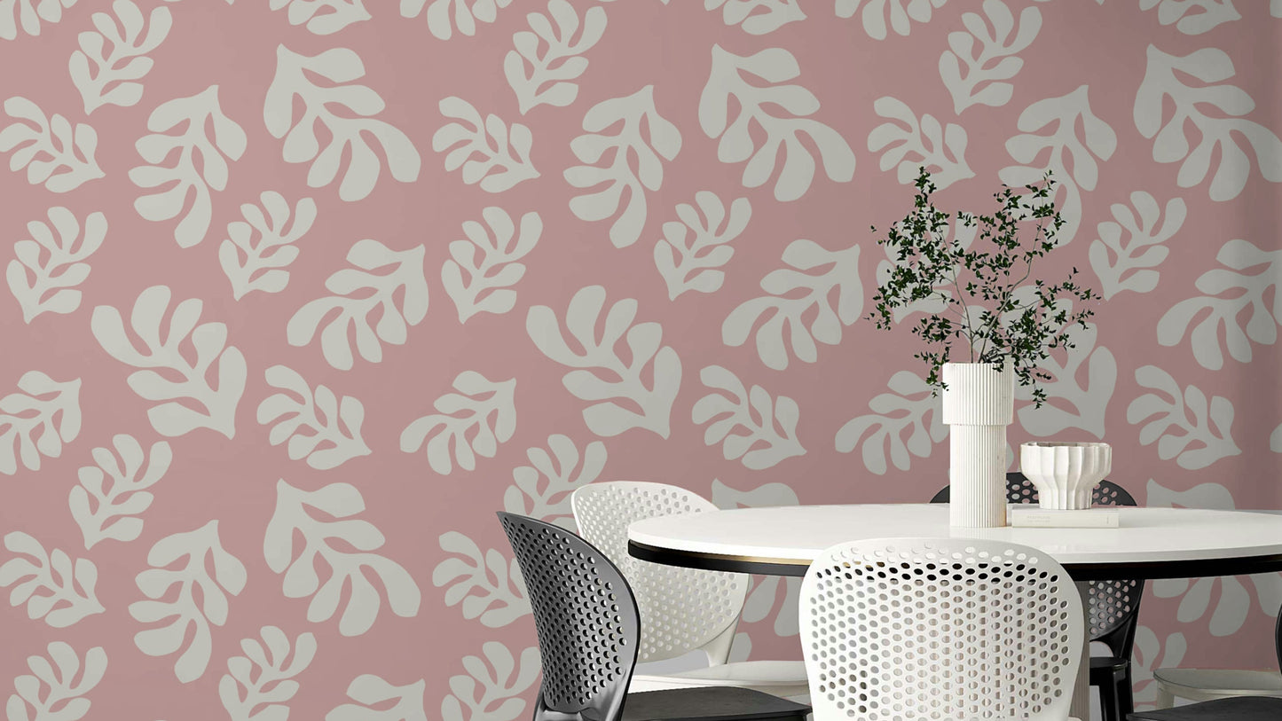 The background is a soft, light color, making the pink leaves stand out.

