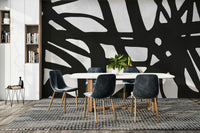 The colors are a dark, sophisticated palette of black and deep gray.

