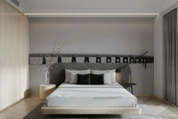 A wall mural of a bridge in a monochrome color scheme.

