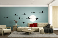 The flamingos are a central focus of the image.

