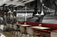 The image shows a full wall with a walkway beside the Thames River.

