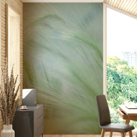 The image shows a full wall with grasses swaying in a gentle breeze.

