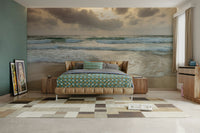 The image shows a full wall with waves rolling onto the sand.

