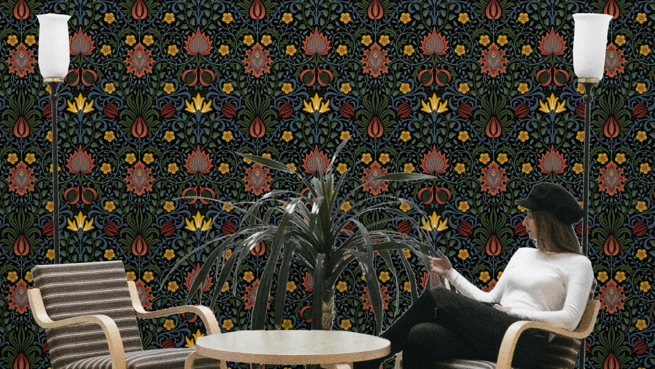 A wallpaper featuring a classic, intricate floral pattern.