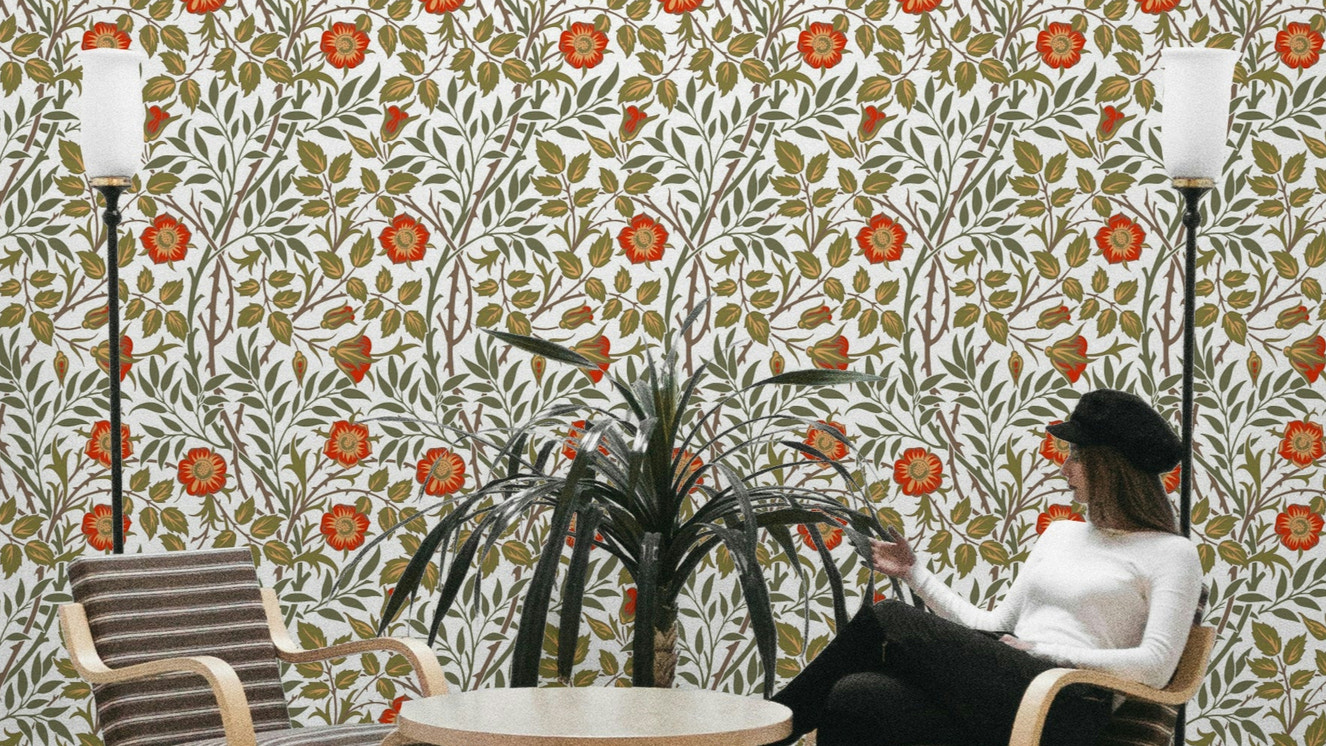 A wallpaper featuring a classic, intricate floral pattern.

