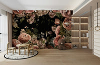 The image shows a full wall with several large flowers on a dark, moody background.

