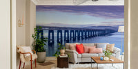 The mural shows a peaceful beach scene with gentle waves.

