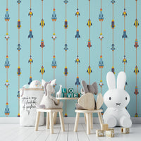 The image shows a repeating design with spaceships, rockets, and stars.

