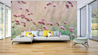 The wall art combines a botanical theme with a soft focus.

