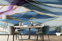 The wall art combines a flowing pattern with metallic accents.

