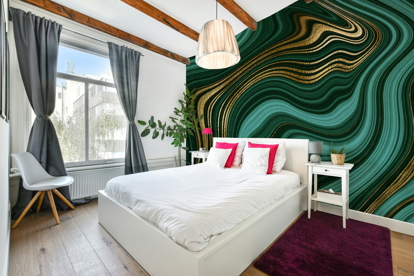 Wall mural with emerald and gold swirls.

