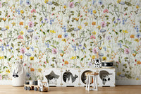 The scene includes colorful wildflowers and blooms.

